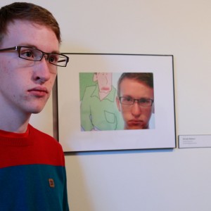 Jacob Chapman standing in front of his piece "Hiroshi Nohara"